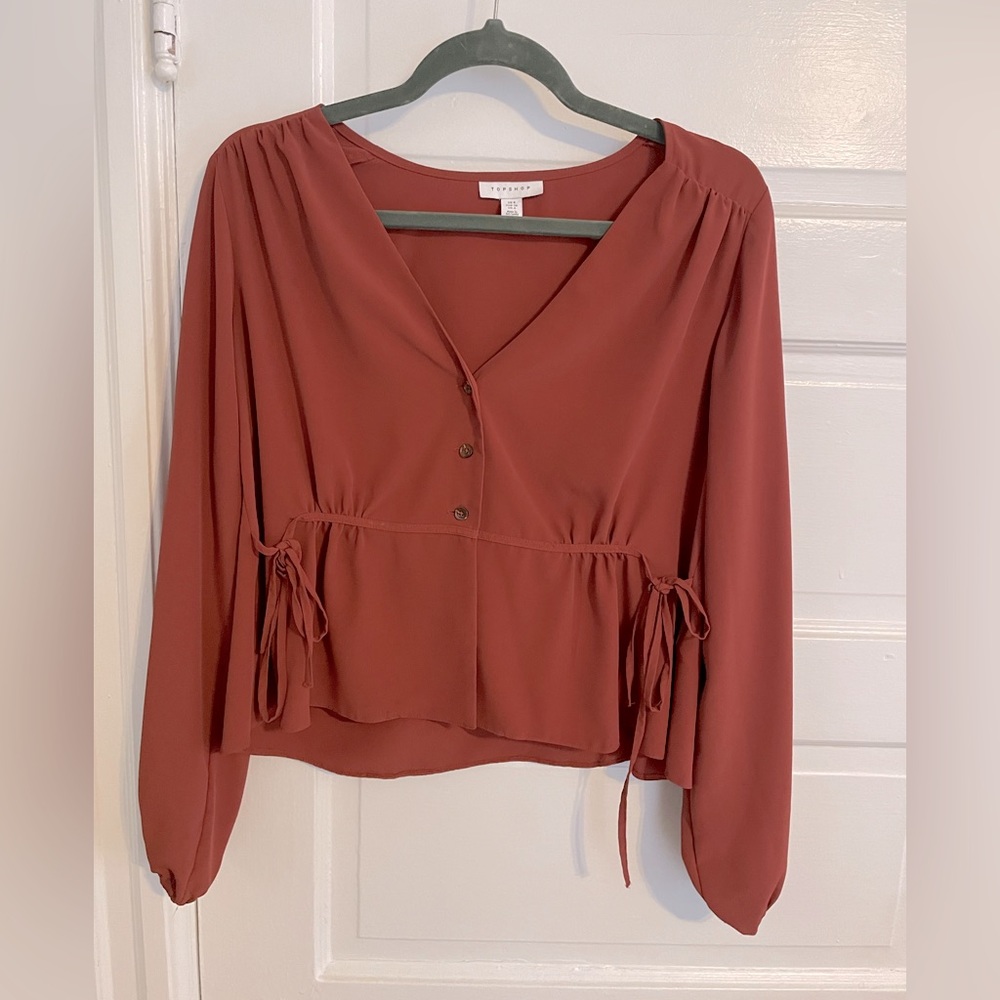 Top shop blouse in rust colored red, size 4, great condition